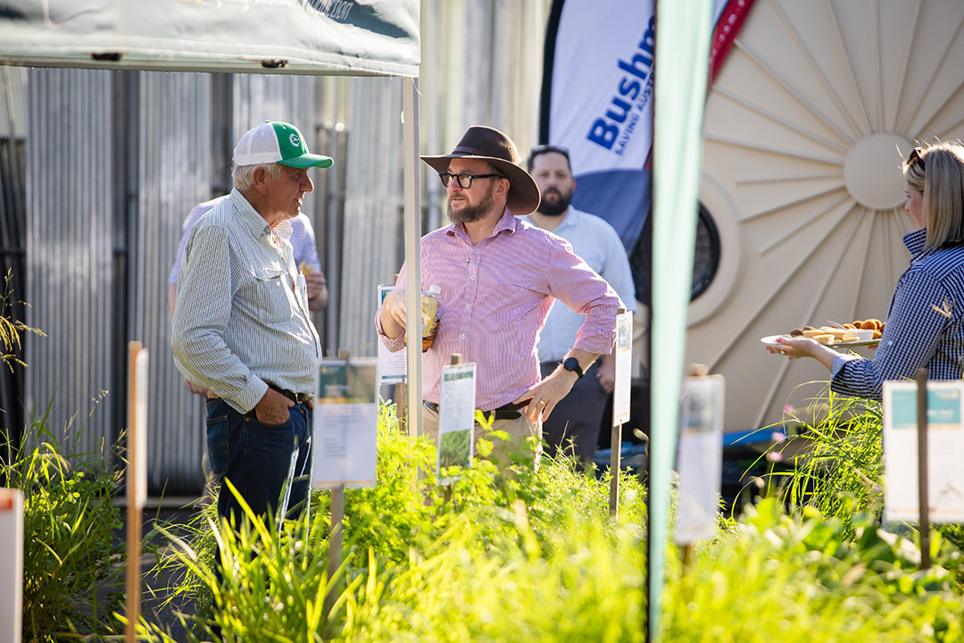 CoBright team member, Brendan, talks to a man outside a stall at the RAFF Group Roadshow